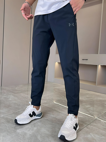 Under Armour - Pantaloni asciutti super elasticizzati unisex